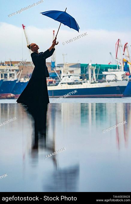 RUSSIA, VLADIVOSTOK - AUGUST 2, 2023: A girl poses for a photo at the construction site of the Vladivostok Grand Hotel & SPA. Yuri Smityuk/TASS
