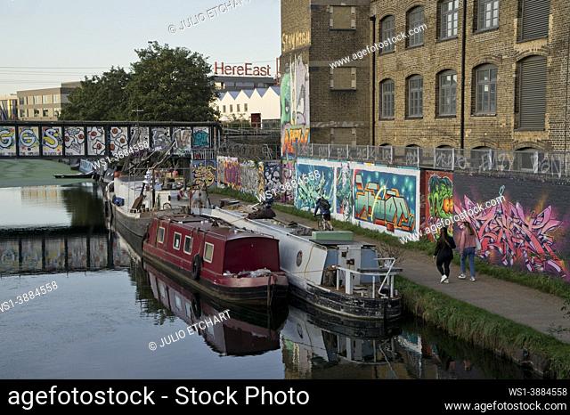 Old pub and warehouse studios by the Lea river canal with graffiti art in Hackney Wick in London; England; UK