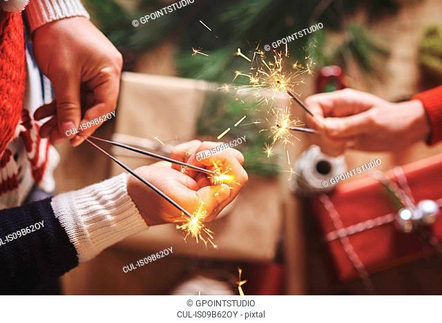 Couple holding indoor sparklers