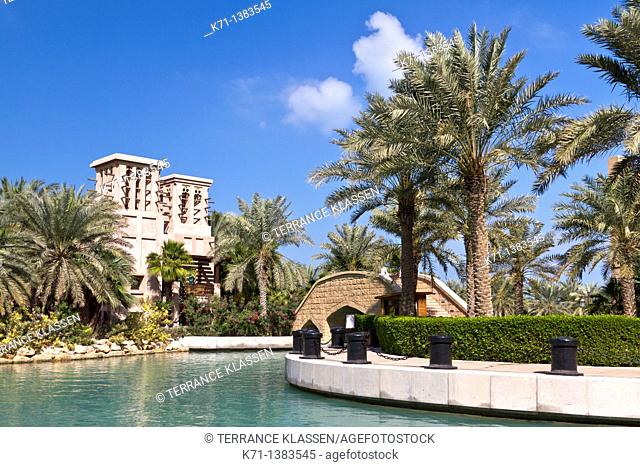 The Madinat Jumeirah with canals and tropical vegetation in Dubai, UAE