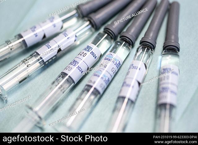 19 October 2023, Saxony, Dresden: Vaccine doses with the seasonal active ingredient against the flu lie on a table during a press event for the flu vaccination...