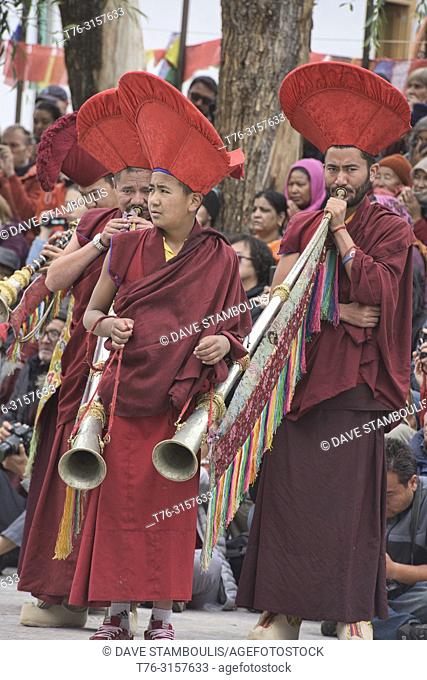 Red hat monks performing at a traditional Tibetan Buddhist Cham dance, Leh, Ladakh, India