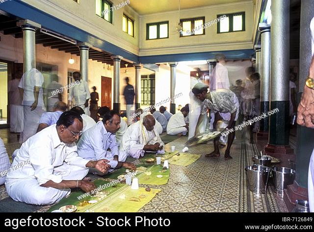 A vegetarian banana leaf wedding break-fast dined in pandikattu; Chettinad home dining hall. Nattukottai Chettiar; Nagarathar community wedding, Chettinad