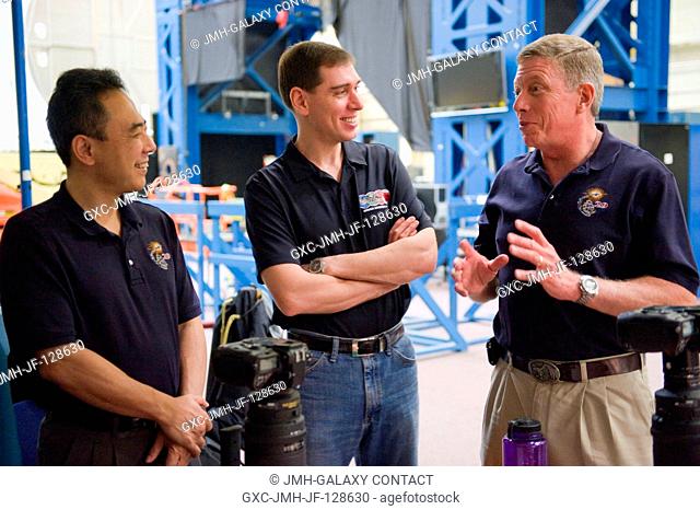 NASA astronaut Mike Fossum (right), Expedition 28 flight engineer and Expedition 29 commander; along with Russian cosmonaut Sergei Volkov (center) and Japan...