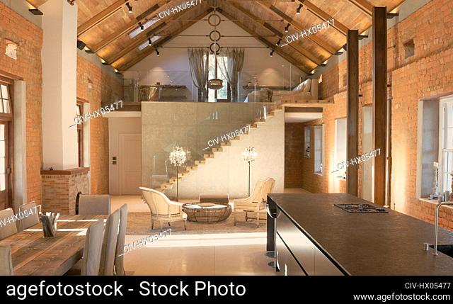 Home showcase interior with vaulted ceiling and loft