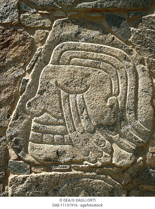 Peru - Cerro Sechin, pre-Inca archaeological site. Stone stele with relief depicting a severed head, Chavin style, 1st millennium b.C