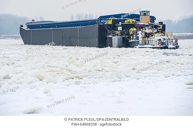 A Polish pushed boat convoy stuck on a sandbank is surrounded by the ice floes on the German-Polish border river Oder, near Reitwein, Germany, 7 January 2016