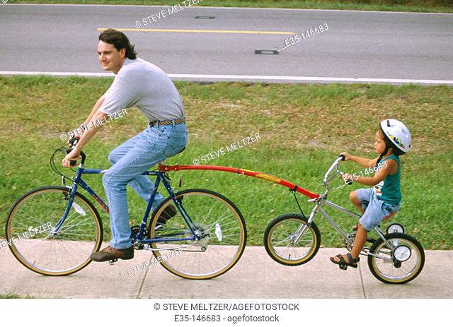 Father and daughter on bicycle