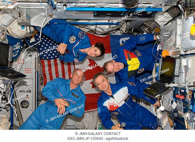 European Space Agency astronaut Frank De Winne (right), Expedition 21 commander; along with Canadian Space Agency astronaut Robert Thirsk (bottom right)