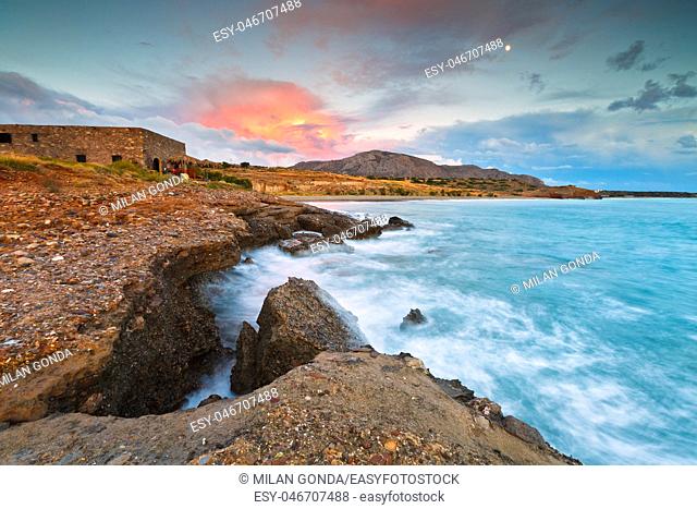 Evening view of the Diaskari beach and old store houses near the village of Makrygialos in Crete, Greece.