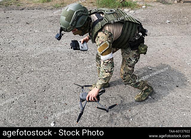 RUSSIA, KHERSON REGION - JUNE 28, 2023: A serviceman of a Russian unmanned aerial vehicle (UAV) unit launches a copter to monitor areas near the route to the...