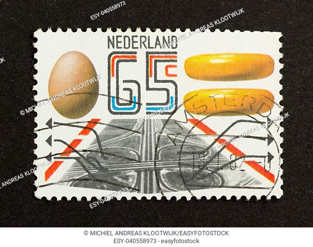 HOLLAND - CIRCA 1980: Stamp printed in the Netherlands shows an egg and some cheese, circa 1980