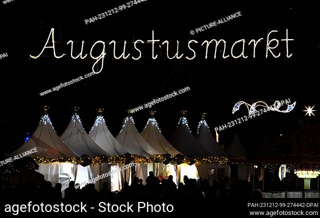 12 December 2023, Saxony, Dresden: Christmas-lit tents are set up at the ""Augustusmarkt"" Christmas market on the main street