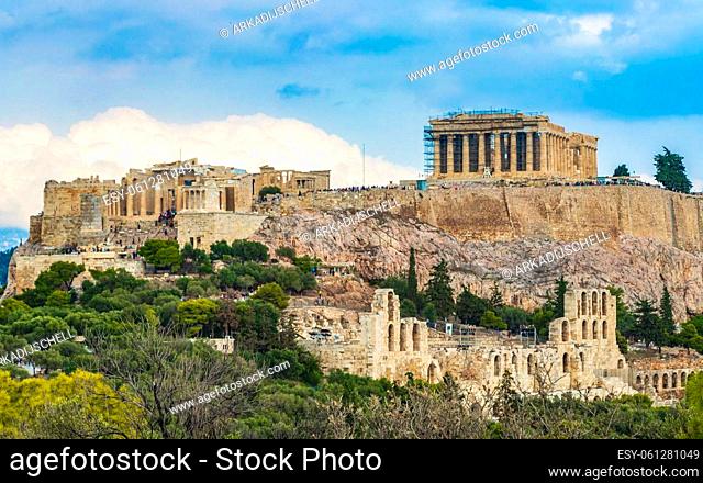 Acropolis of Athens on hill with amazing and beautiful ruins Parthenon and blue cloudy sky in Greece's capital Athens in Greece