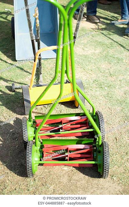 Grass lawn mower with grip for hands