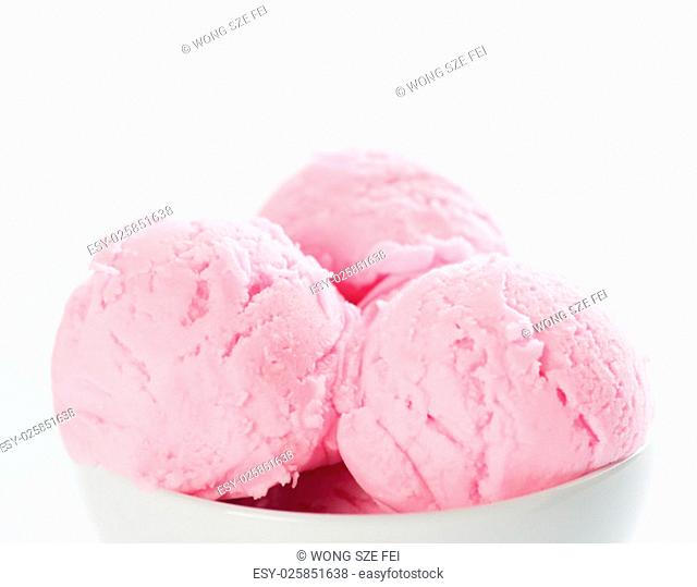 Close up scoops pink ice cream in bowl with copy space on top, white background