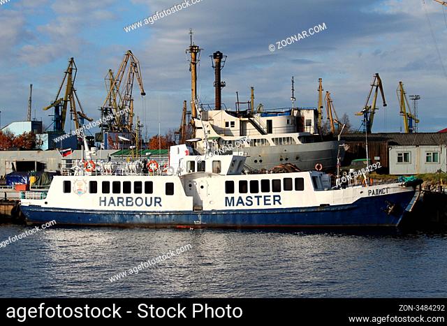 Boat near pier in port Murmansk, north Russia