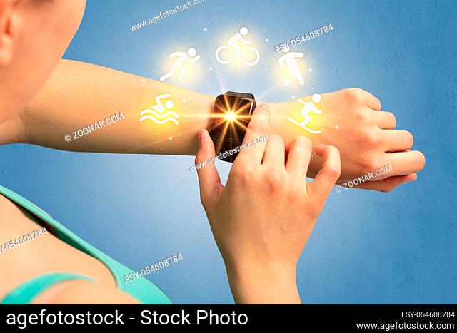 Female hand with smartwatch and sport concept