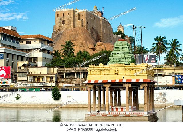 Rock fort and vinayaka temple and teppakulam with holy tank at Tiruchirappalli , Tamil Nadu , India