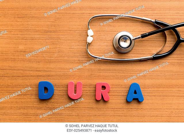 dura colorful medical word and stethoscope on the wooden background