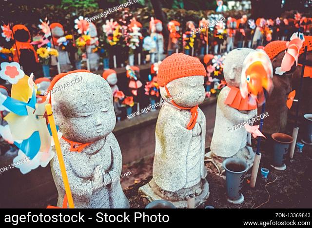 Jizo statues at Zojo-ji temple cemetery, Tokyo, Japan