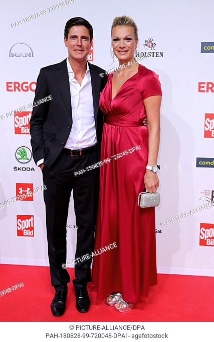 27 August 2018, Hamburg, Germany: Maria Hoefl-Riesch, former German ski racer, and her husband Marcus Höfl attend the presentation of the ""Sport Bild Award...