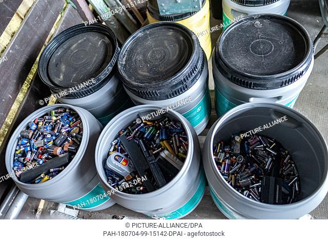 19 June 2018, Hanover, Germany: Batteries are in a disposal bin at a recycling center in Hanover. Whether button cell from the hearing aid or alkaline-manganese...
