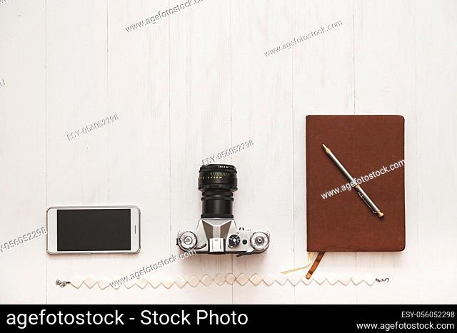 Concept set blogger hipster girl on a white wooden background with space for text