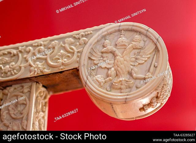 RUSSIA, MOSCOW - OCTOBER 12, 2023: An arm rest of an ivory throne of Tsar Ivan IV of Russia features a carved double-headed eagle emblem on display during the...