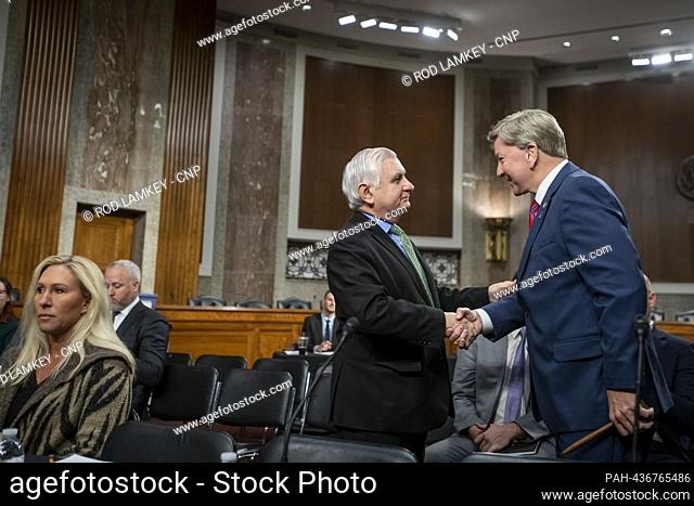United States House Armed Services Chairman Mike Rogers (Republican of Alabama), right, receives the gavel from US Senate Armed Services Chairman Jack Reed...