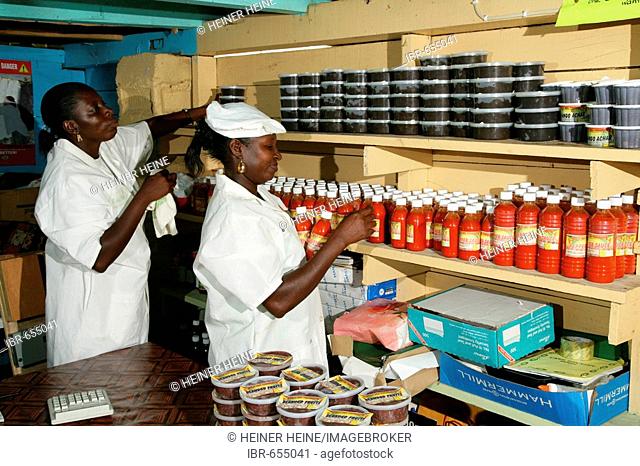 Two women at a grocery warehouse in New Amsterdam, Guyana, South America