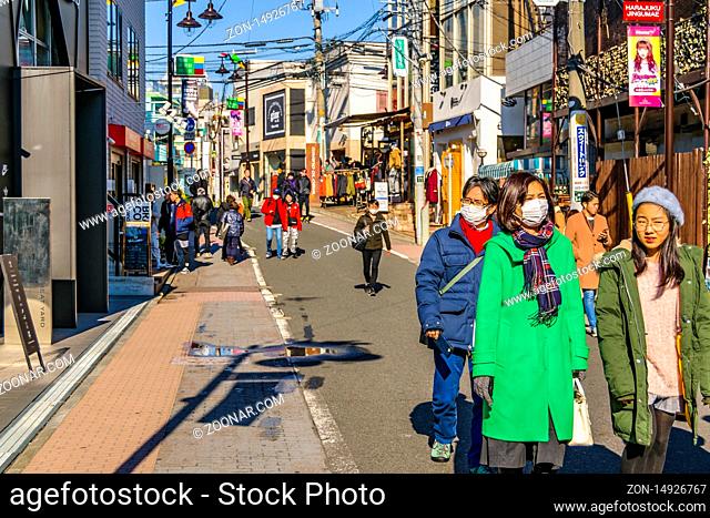 TOKYO, JAPAN, JANUARY - 2019 - People walking at pedestrian street at omotesando area, shibuya district, tokyo, japan
