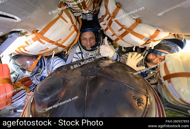 Expedition 66 crew members Mark Vande Hei of NASA, left, cosmonauts Anton Shkaplerov, center, and Pyotr Dubrov of Roscosmos
