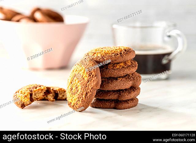 Sweet chocolate cookies. Tasty biscuits on white table