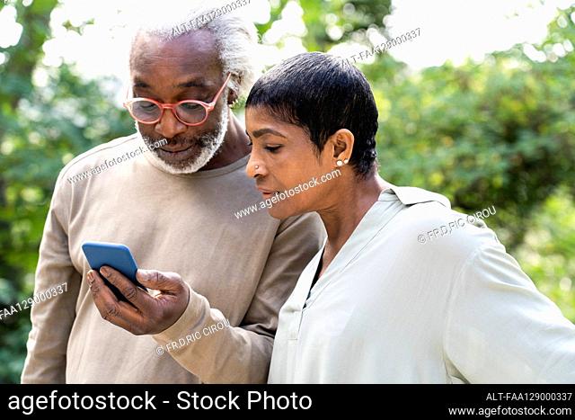 Couple using smart phone