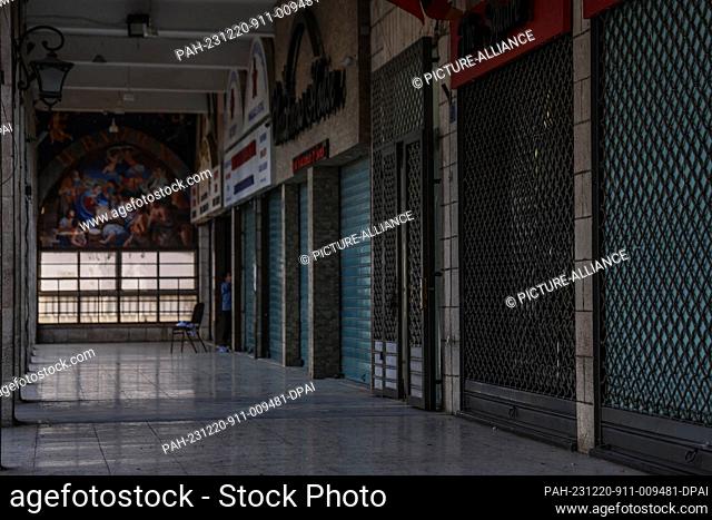 20 December 2023, Palestinian Territories, Bethlehem: A general view of closed Bethlehem souvenir shops, which are deserted after Christmas celebrations were...