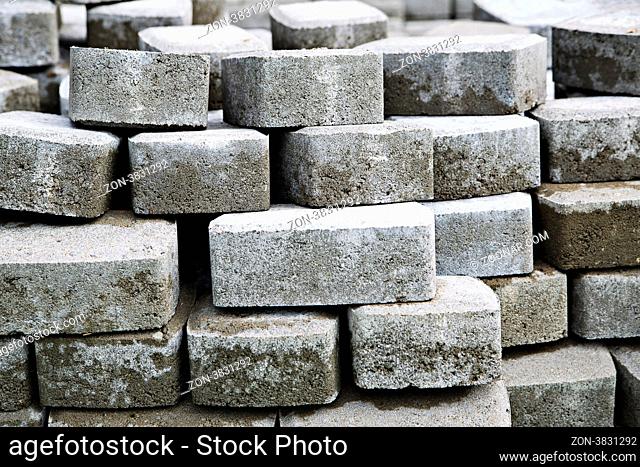 Pile of grey bricks lay on each other