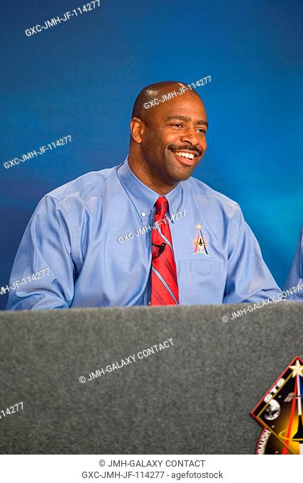 Astronaut Leland Melvin, STS-129 mission specialist, responds to a question from a reporter during an STS-129 preflight press briefing at NASA's Johnson Space...