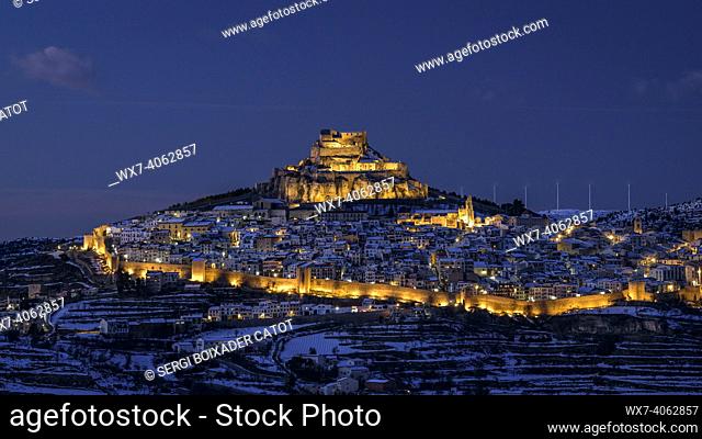 Morella medieval city in a winter twilight and night, after a snowfall (Castellón province, Valencian Community, Spain)