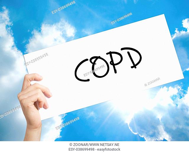 COPD Sign on white paper. Man Hand Holding Paper with text. Isolated on sky background