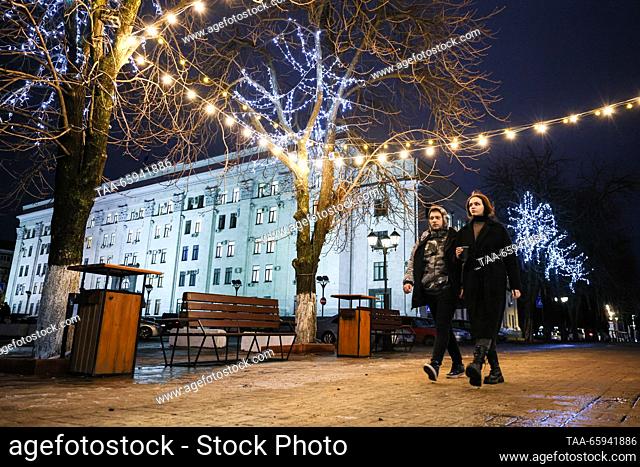 RUSSIA, LUGANSK - DECEMBER 20, 2023: String lights hang from the trees in War Heroes Square. Alexander Reka/TASS
