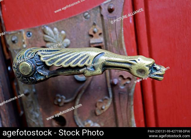 PRODUCTION - 31 January 2023, Saxony-Anhalt, Wernigerode: View of the door handle to the tower ascent of the castle. A fairy-tale castle without a ghost - there...