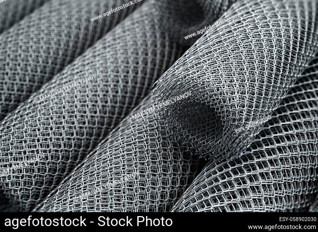 Coils of steel wire. Rabitz mesh netting rolls in warehouse. 3d illustration