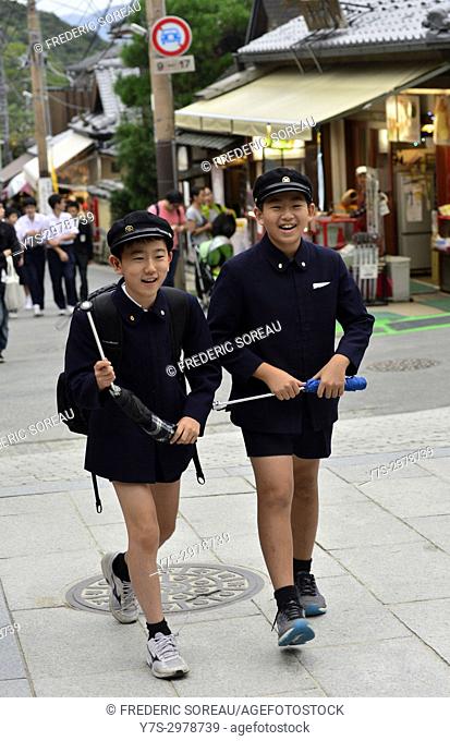 Japanese school boy wearing old fashioned uniform in Kyoto, Japan, Asia