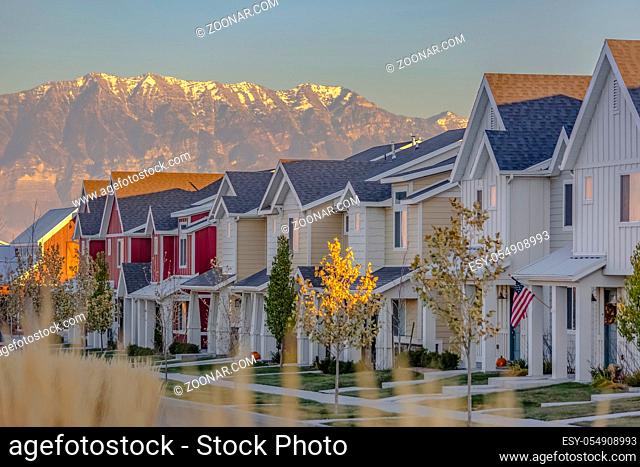 Townhomes in a row in Utah Valley suburbs. Saratoga Springs has many family-friendly features around their suburbs
