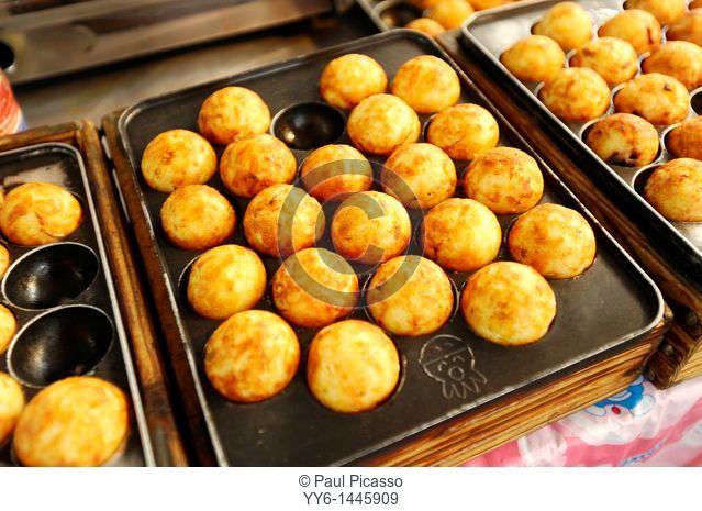 Takoyaki , a popular ball-shaped Japanese dumpling with octopus inside, japanese cuisine , food court , bangkok, thailand
