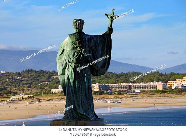 Europe, Portugal, Algarve, Faro district, Lagos, statue of Sao Goncalo de Lagos patron of the city of Lagos, in background Meia Praia