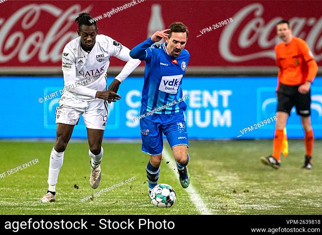 Eupen's Amara Baby and Gent's Sven Kums fight for the ball during a soccer match between KAA Gent and KAS Eupen, Sunday 07 February 2021 in Gent
