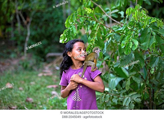 South America , Brazil, Amazonas state, Manaus, Amazon river basin, child and Common squirrel monkey (Saimiri sciureus)