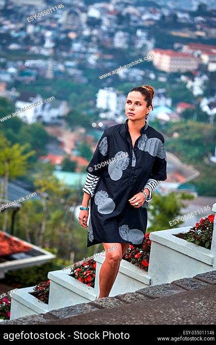 Beautiful woman overlooking the city view, Dalat, Vietnam